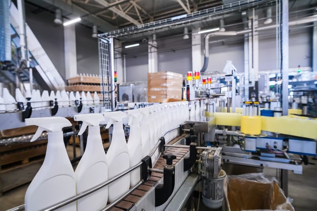 Automated packaging line filling industrial spray bottles