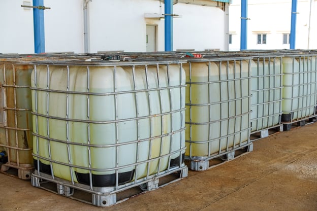 Industrial chemical totes stored inside manufacturing facilitytock_1952226661-1