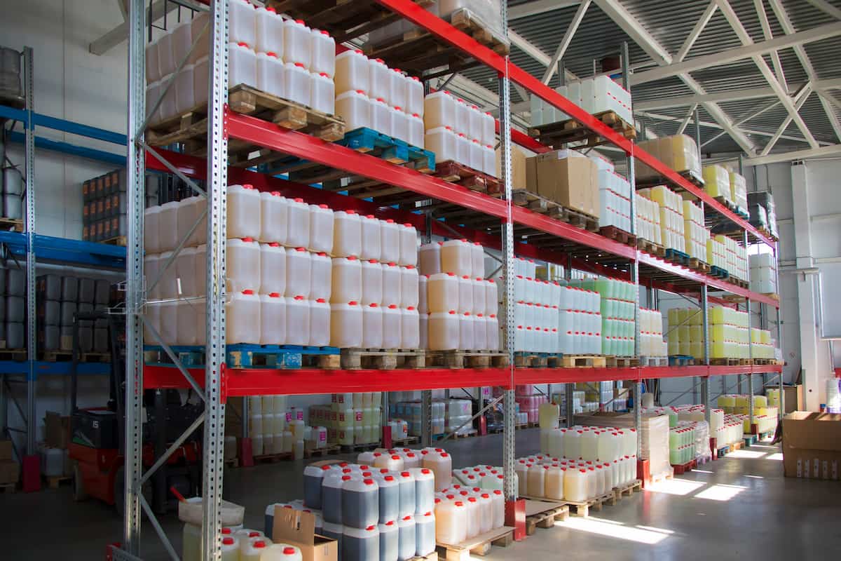 drum and bottles for chemical products with hazard labels