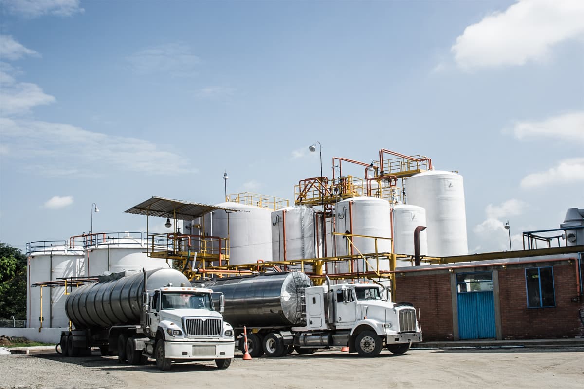 Trucks transporting bulk chemicals from contract manufacturing facility